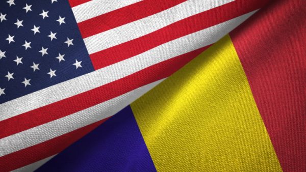 United States and Romania flags together textile cloth, fabric texture